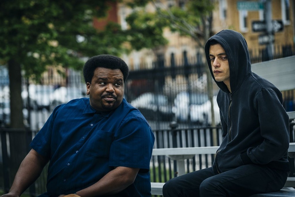MR. ROBOT -- "eps2.0_unmasking.zip" Episode 201 -- Pictured: (l-r) Craig Robinson as Ray, Rami Malek as Eliot Alderson -- (Photo by: Michael Parmelee/USA Network)
